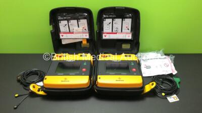 2 x Lifepak 1000 Defibrillators with 2 x 3 Lead ECG Leads and Cases (Both Power Up wth Stock Batteries - Not Included) *38349588 - 38992125*