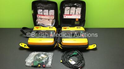 2 x Lifepak 1000 Defibrillators with 2 x 3 Lead ECG Leads and Cases (Both Power Up wth Stock Batteries - Not Included) *39940040 - 40854965*