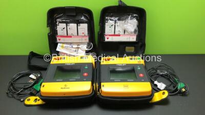 2 x Lifepak 1000 Defibrillators with 2 x 3 Lead ECG Leads and Cases (Both Power Up wth Stock Batteries - Not Included) *39940033 - 35422346*