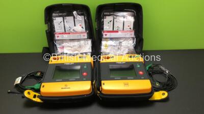 2 x Lifepak 1000 Defibrillators with 2 x 3 Lead ECG Leads and Cases (Both Power Up wth Stock Batteries - Not Included) *38378774 - 39940036*