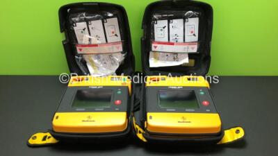 2 x Lifepak 1000 Defibrillators and Cases (Both Power Up wth Stock Batteries - Not Included) *338378797 - 35422325*