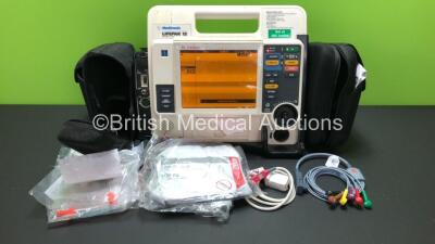 Medtronic Lifepak 12 Biphasic Defibrillator / Monitor Including ECG, SPO2, CO2, NIBP and Printer Options with 1 x SpO2 Lead, 1 x Ref.1111-000023 ECG Lead and 2 x Batteries in Carry Case *Mfd 2009* (Powers Up with Service Light) *37628612*