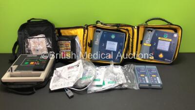 Job Lot Including 1 x Philips FR2+ Defibrillator, 1 x Laerdal FR2 Defibrillator with 4 x Batteries *Install Before 11-2020 - 04-2021 - 05-2020 - 11-2020* and Carry Cases (Both Power Up and Pass Self Test) and 1 x Lifepak AED Trainer with Controller in Car