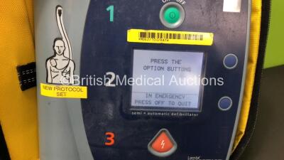 Job Lot Including 1 x Philips FR2+ Defibrillator, 1 x Laerdal FR2 Defibrillator with 4 x Batteries *Install Before 11-2020 - 04-2021 - 05-2020 - 11-2020* and Carry Cases (Both Power Up and Pass Self Test) and 1 x Lifepak AED Trainer with Controller in Car - 2