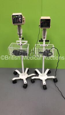 2 x Criticare Systems Inc ComfortCuff Patient Monitors on Stands (1 x Powers Up,1 x No Power)