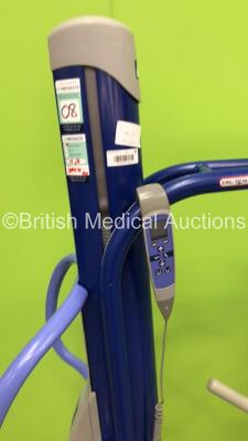 1 x Arjo Maxi Move Electric Patient Hoist with Controller and 1 x Liko Golvo 7007 ES Electric Patient Hoist with Controller (Unable to Test Due to No Batteries) * Equip No 072562 * - 2