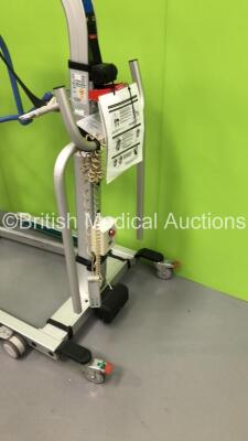 1 x Arjo Maxi Move Electric Patient Hoist with Controller and 1 x Liko Golvo 7007 ES Electric Patient Hoist with Controller (Unable to Test Due to No Batteries) * Equip No 072562 * - 4