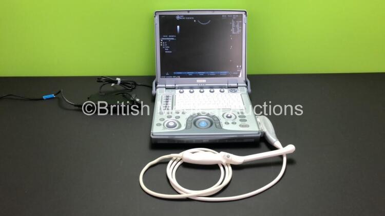 GE Logiq E Portable Flat Screen Ultrasound Scanner Ref 5199704 with Power Supply (Powers Up) *SN 114041WX7* *Mfd 2009* and 1 x E8C-RS Transducer - Probe *Assembled 2019-08* (Slight Damage to Probe Head - See Photo)