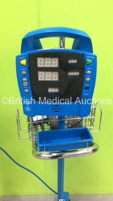 1 x Datascope Trio Patient Monitor on Stand (Powers Up - Damage to SPO2 Port) and 1 x GE Dinamap Procare Auscultatory 100 Vital Signs Monitor on Stand (No Power - Missing Face Cover) *S/N DPC120X-EN1* - 2