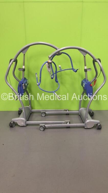 2 x Arjo Maxi-Twin Electric Patient Hoists with 1 x Battery and 2 x Controllers (Both No Power)