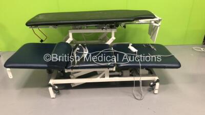 1 x Akron Electric Tilt Table with Controller and 1 x Huntleigh 3 Way Electric Patient Examination Couch with Controller (Powers Up)