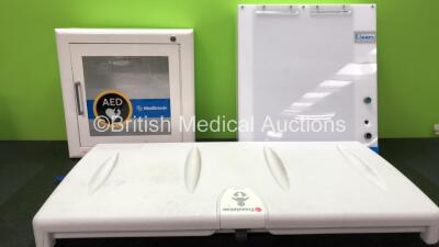 Mixed Lot Including 1 x Medtronics AED Defibrillator Storage Box (Fully Functional Alarm with Missing Key) 1 x Everything X Ray Light Box (Powers Up with Missing Button-See Photo) 1 x Always Attend Baby Changing Wall Restraint Unit *SN 3012604031, 090217*