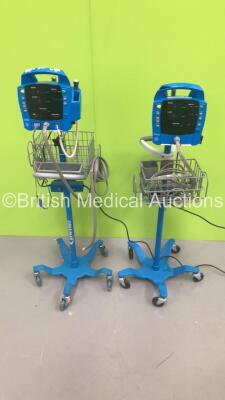 2 x GE Dinamap ProCare Auscultatory Vital Signs Monitors on Stands with 2 x BP Hoses and 1 x SPO2 Finger Sensor (Both Power Up)