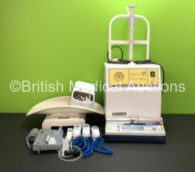 Mixed Lot Including 1 x SAM 35 Medical Suction Unit, 1 x Carefusion IVAC PCAM Syringe Pump (Damaged Screen, No Key), 3 x Covidien Genius 2 Tympanic Thermometers with Bases, 1 x Braun Thermoscan Tympanic Thermometer, 1 x Microlab Spirometer, 1 x Seca Baby 