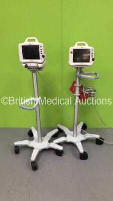 2 x GE Dash 3000 Patient Monitors on Stands with BP1,BP2,SpO2,Temp/CO,CO2,NBP and ECG Options,1 x BP Hose,1 x SpO2 Finger Sensor and 1 x ECG Lead (Both Power Up-2 x Cracks to Casing and 1 x Damaged Handle)