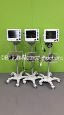 3 x Criticare Systems Inc nGenuity Patient Monitors on Stands with ECG/Resp,Temp,SpO2 and NIBP Options,3 x BP Hoses,3 x BP Cuffs and 3 x 3-Lead ECG Leads (All Power Up) * SN 209246717 / 209246758 / 209245590 *