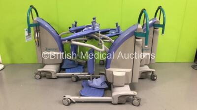 3 x Arjo Encore Electric Patient Standing Hoists with Controllers and 4 x Batteries (All Power Up)