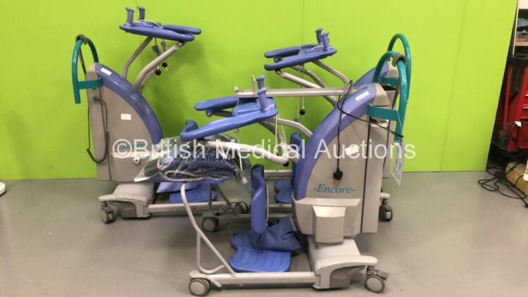 3 x Arjo Encore Electric Patient Standing Hoists with Controllers,Slings,Battery Charger and 3 x Batteries(2 x Power Up,1 x No Power-Suspected Flat Battery)