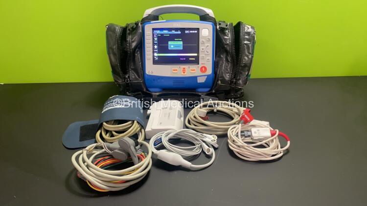 Zoll X Series 12 Lead Monitor / Defibrillator with ECG, SPO2, NIBP, CO2 and Printer Options, 2 x Batteries (1 x Housed within Unit), 1 x NIBP Cuff and Hose, 1 x SPO2 Finger Sensor, 1 x Paddle Lead, 12 Lead ECG Lead, WiFi Dongle and Base Bracket in a Zoll