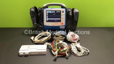 Zoll X Series 12 Lead Monitor / Defibrillator with ECG, SPO2, NIBP, CO2 and Printer Options, 2 x Batteries (1 x Housed within Unit), 1 x NIBP Cuff and Hose, 1 x SPO2 Finger Sensor, 1 x Paddle Lead, 12 Lead ECG Lead, WiFi Dongle and Base Bracket in a Zoll 