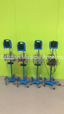 Job Lot of 4 x GE Dinamap Patient Monitors Including 1 x GE Carescape V100 Patient Monitor with 1 x BP Cuff on Stand,1 x GE ProCare Patient Monitor on Stand with 1 x SpO2 Finger Sensor and 1 x BP Cuff and 2 x GE ProCare 300 Patient Monitors on Stands with