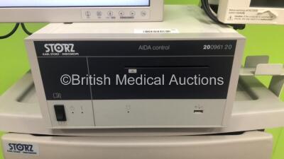 Storz Stack Trolley with Storz HD WideView Monitor, Storz 200903 31 Touch Screen Monitor, Storz 200961 20 Aida Control Unit, Storz 201315 20 Xenon Nova Light Source, Storz 222010 20 SCB Image 1 Hub,1 x Storz Image 1 HD H3 Camera Head,1 x Storz P3 Camera H - 3