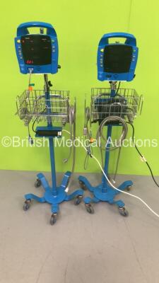 2 x GE ProCare Auscultatory 300 Patient Monitors on Stands with 2 x SpO2 Finger Sensors,2 x BP Hoses and 1 x BP Cuff (Both Power Up with Errors-See Photos) * SN 2019194-001 / 2019194-001 *