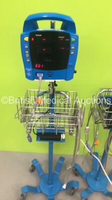 2 x GE ProCare Auscultatory 300 Patient Monitors on Stands with 2 x SpO2 Finger Sensors,2 x BP Hoses and 1 x BP Cuff (Both Power Up with Errors-See Photos) * SN 2019194-001 / 2019194-001 * - 2