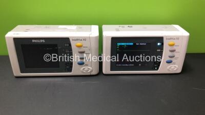 2 x Philips IntelliVue X2 Handheld Patient Monitors Including ECG, SpO2, NBP, Temp, and Press Options Software Revision F.01.47 - H.15.45 *Mfd 2011 - 2009* (Both Power Up)