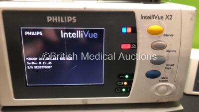 2 x Philips IntelliVue X2 Handheld Patient Monitors Including ECG, SpO2, NBP, Temp, and Press Options Software Revision H.15.45 - H.15.36 *Mfd 2012 - 2008* (Both Power Up) - 2