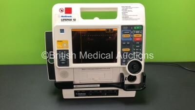 Physio Control Lifepak 12 Biphasic Defibrillator / Monitor Including ECG and Printer Options and Lifepak AC Power Adaptor and 2 x Lifepak SLA Batteries (Powers Up with Mains Supply)