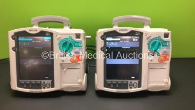 2 x Philips Heartstart MRx Defibrillators Including 2 x Pacer, 1 x C02, 2 x ECG and Printer Option with 2 x Philips M3539A Batteries, 2 x Philips M3538 Module *Mfd 2015 - 2010* (Both Power Up)