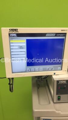 Storz Stack Trolley with Storz WideView HD Monitor, Storz 200903 31 Touch Screen Monitor. Storz 264305 20 SCB Electronic Endoflator, Storz 200960 20 AIDA Control Unit, Storz 201340 20 Xenon Nova 300 Light Source and Storz 222010 20 SCB Image 1 Hub Camera - 3