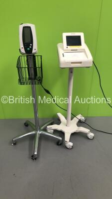 1 x Welch Allyn Spot Vital Signs Monitor on Stand and 1 x Philips Avalon FM30 Fetal Monitor on Stand (1 x Powers Up,1 x Powers Up and Then Cuts Out)