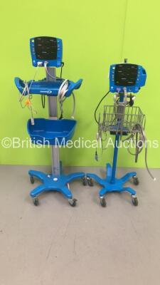 2 x GE Carescape V100 Vital Signs Monitors on Stands with SPO2 Finger Sensors and BP Hoses (Both Power Up)