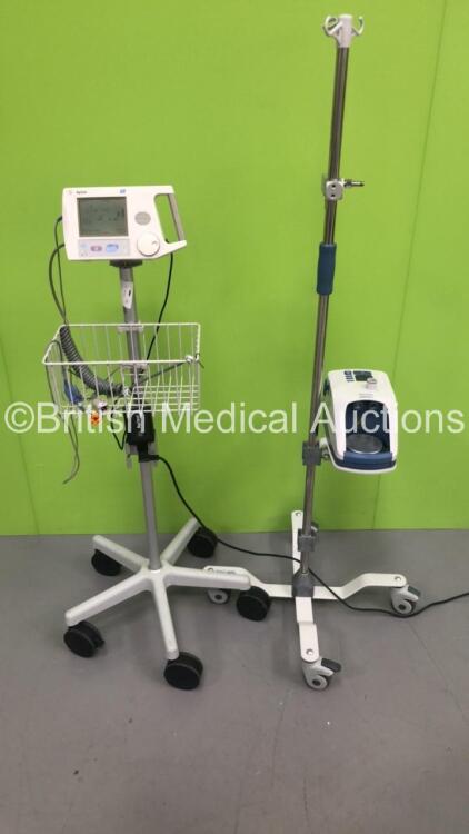 1 x Fisher and Paykel Airvo 2 Humidifier on Stand (Unable to Power Test Due to No Power Supply - Missing Button - See Pictures) and 1 x Agilent A1 Patient Monitor on Stand with SPO2 Finger Sensor and BP Hose (Powers Up)