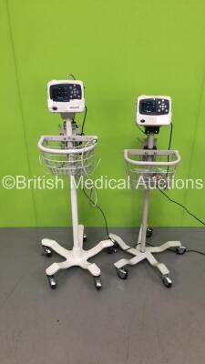 2 x Welch Allyn ProPaq LT Patient Monitors on Stands with 1 x ECG Lead and 1 x BP Hose (Both Power Up)