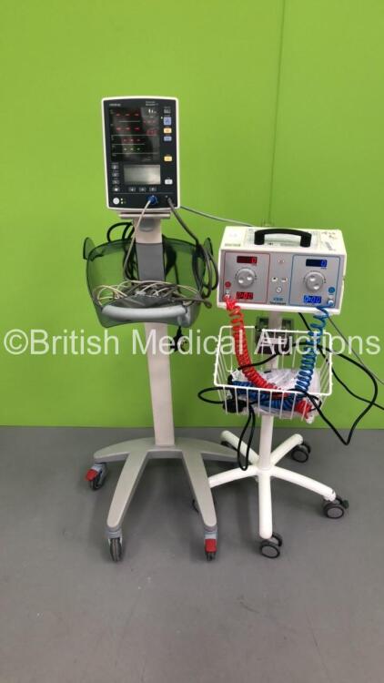 1 x Mindray Datascope Accutorr V Vital SIgns Monitor on Stand with SPO2 Finger Sensor and BP Hose and 1 x VBM Digital Tourniquet 9000 on Stand with Hoses (Both Power Up)