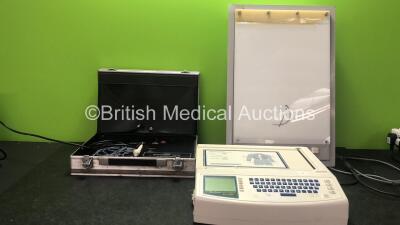 Mixed Lot Including 1 x Leeds Psychomotor Tester (Powers Up with Damaged Case-See Photo) 1 x Mortara Instruments Eli 250 ECG Machine (Powers Up) 1 x Rosenburgh Light Box (Powers Up with Damage-See Photo)