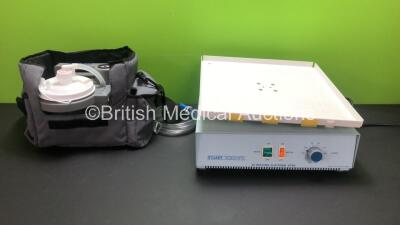 1 x DeVilbiss Homecare Suction Unit with Cup, Power Supply and Carry Bag and 1 x Stuart Scientific 3D Rocking Platform STR9 Unit (Both Power Up)