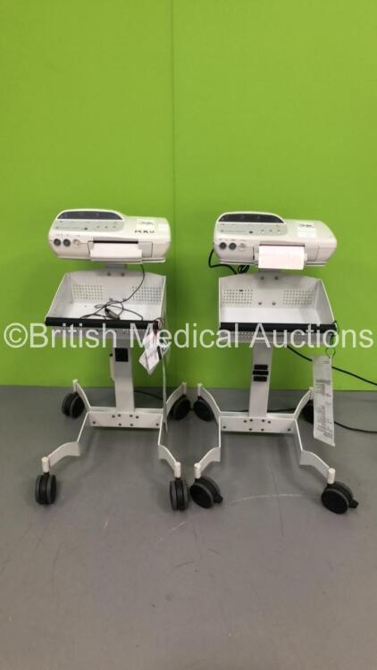 2 x GE Corometrics 170 Series Fetal Monitors on Stands with 1 x Finger Trigger (1 x Powers Up,1 x Unable to Test Due to Faulty Power Input)