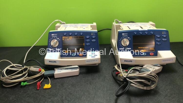 1 x Philips Heartstart XL Smart Biphasic Defibrillators Including Pacer, ECG and Printer Options and 1 x Philips Heartstart XL Smart Biphasic Defibrillators Including ECG and Printer Options with 2 x Paddle Leads, 2 x Philips M3725A Test Loads and 2 x 3