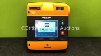 Medtronic Lifepak 1000 Defibrillator (Powers Up when Tested with Stock Battery, Damaged Screen - Battery Not Included)