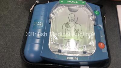 3 x Philips Heartstart HS1 Defibrillators with 3 x Philips Ref M5070A Batteries *Install Dates - 11-2026, 11-2026, 11-2026* with 3 x Philips M5071A Smart Pads Cartridge *Use By Dates- 07-2023. 07-2023, 07-2023* (All Power Up and Boxed in Excellent Conditi - 2