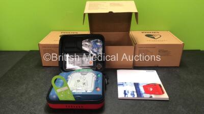 3 x Philips Heartstart HS1 Defibrillators with 3 x Philips Ref M5070A Batteries *Install Dates - 11-2026, 11-2026, 11-2026* with 3 x Philips M5071A Smart Pads Cartridge *Use By Dates- 07-2023. 07-2023, 07-2023* (All Power Up and Boxed in Excellent Conditi
