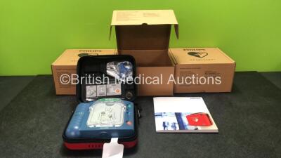 3 x Philips Heartstart HS1 Defibrillators with 3 x Philips Ref M5070A Batteries *Install Dates - 11-2026, 11-2026, 11-2026* with 3 x Philips M5071A Smart Pads Cartridge *Use By Dates- 07-2023. 07-2023, 07-2023* (All Power Up and Boxed in Excellent Conditi