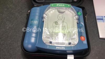 3 x Philips Heartstart HS1 Defibrillators with 3 x Philips Ref M5070A Batteries *Install Dates - 11-2026, 11-2026, 11-2026* with 3 x Philips M5071A Smart Pads Cartridge *Use By Dates- 07-2023. 07-2023, 07-2023* (All Power Up and Boxed in Excellent Conditi - 2