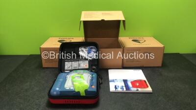 3 x Philips Heartstart HS1 Defibrillators with 3 x Philips Ref M5070A Batteries *Install Dates - 11-2026, 11-2026, 11-2026* with 3 x Philips M5071A Smart Pads Cartridge *Use By Dates- 07-2023. 07-2023, 07-2023* (All Power Up and Boxed in Excellent Conditi