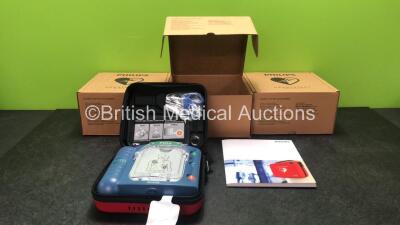 3 x Philips Heartstart HS1 Defibrillators with 3 x Philips Ref M5070A Batteries *Install Dates - 11-2026, 11-2026, 11-2026* with 3 x Philips M5071A Smart Pads Cartridge *Use By Dates- 07-2023. 07-2023, 07-2023* (All Power Up and Boxed in Excellent Conditi