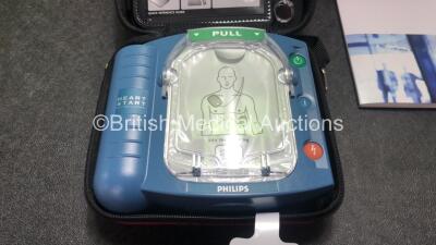 3 x Philips Heartstart HS1 Defibrillators with 3 x Philips Ref M5070A Batteries *Install Dates - 11-2026, 11-2026, 11-2026* with 3 x Philips M5071A Smart Pads Cartridge *Use By Dates- 07-2023. 07-2023, 07-2023* (All Power Up and Boxed in Excellent Conditi - 2